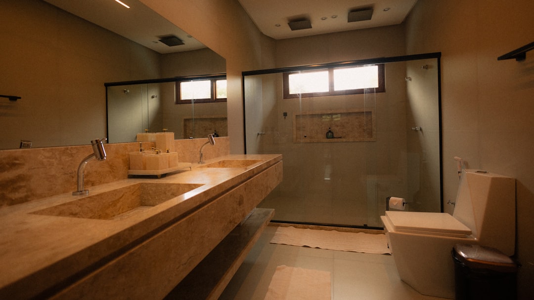 modern-bathroom-with-double-vanity-and-glass-shower-k8bh3lzpsyi